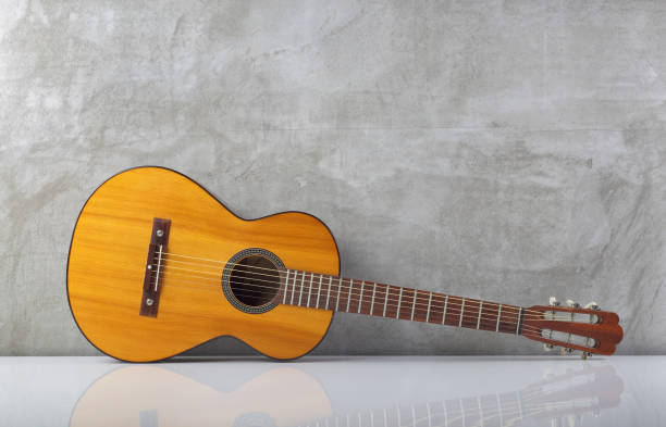 istock Musical instrument - Front view parlor acoustic classic guitar with a reflection 2196947125