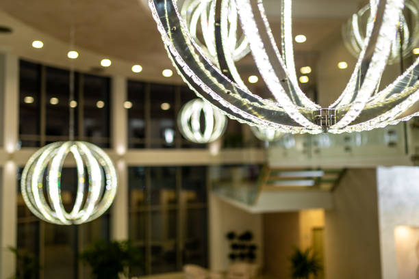 Elegant contemporary interior showcasing illuminated circular chandeliers, modern decor, and clean architectural aesthetics embodying sophistication and style