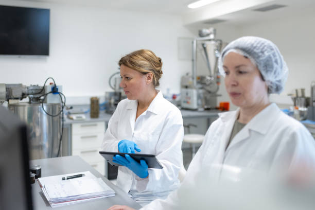 istock Female Scientists Working in The Laboratory of Pharmaceutical Factory, using Computer and Tablet 2196950147