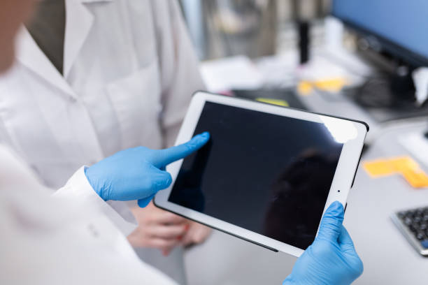 istock Female Scientists Working in The Laboratory of Pharmaceutical Factory, using Computer and Tablet 2196950171