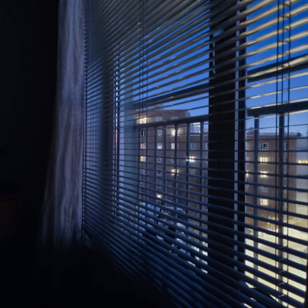 Evning window Evening lights in the window. Winter. dark window blinds stock pictures, royalty-free photos & images