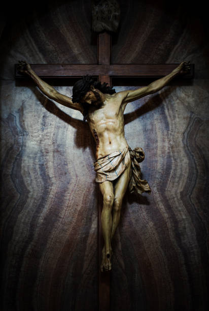 istock Wooden Crucifix of Christ in Dramatic Lighting 2196951908