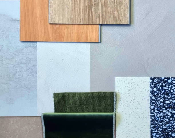 istock interior decoration material samples including wooden vinyl tile, concrete laminated, green draperies, artificial stones in close up view. 2196952153