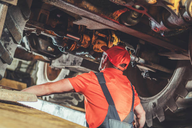 istock Mechanic Inspecting Heavy Machinery Components in a Workshop During Daylight Hours 2196952606