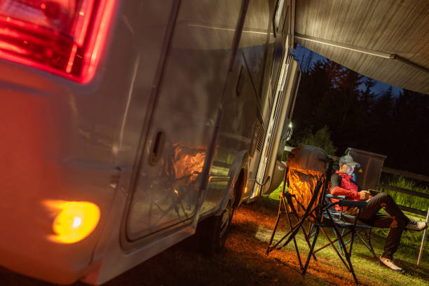 istock Relaxing at Dusk Next to a Cozy Camper in the Peaceful Wilderness 2196952644