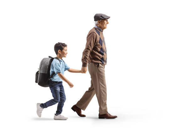 istock Grandfather walking grandson to school 2196954691