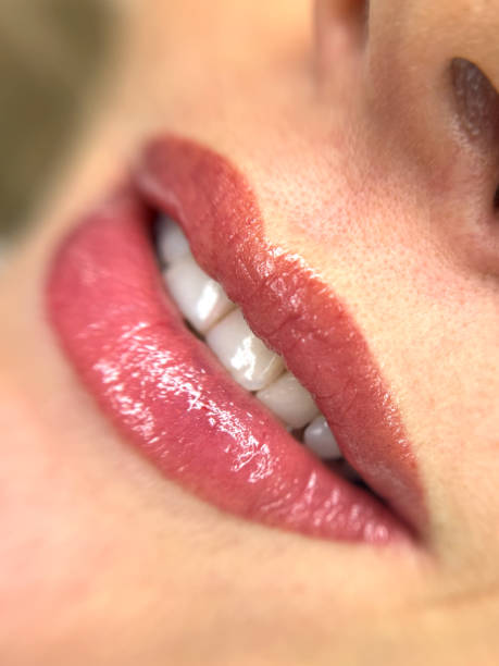 istock female lips and teeth close-up. 2196955047