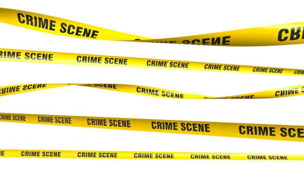 Yellow crime scene tapes hanging and blocking access Yellow crime scene tapes hanging and blocking access to restricted area barricade tape stock pictures, royalty-free photos & images