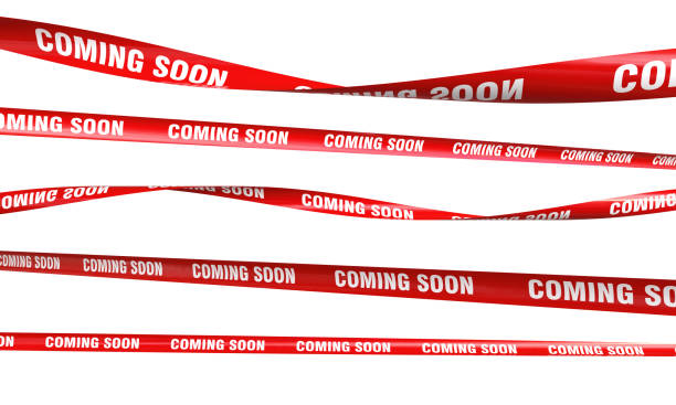 istock Red ribbons with coming soon text announcing an upcoming event 2196957930