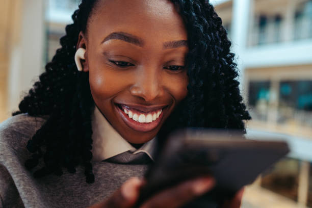 istock African-American woman using smartphone in office 2196958016