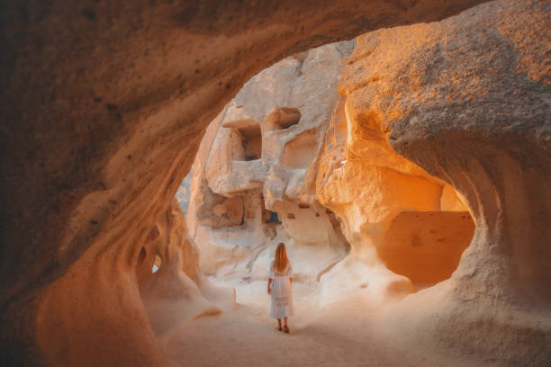 istock Woman Exploring Ancient Cave Dwellings in Cappadocia, Turkiye 2196961320
