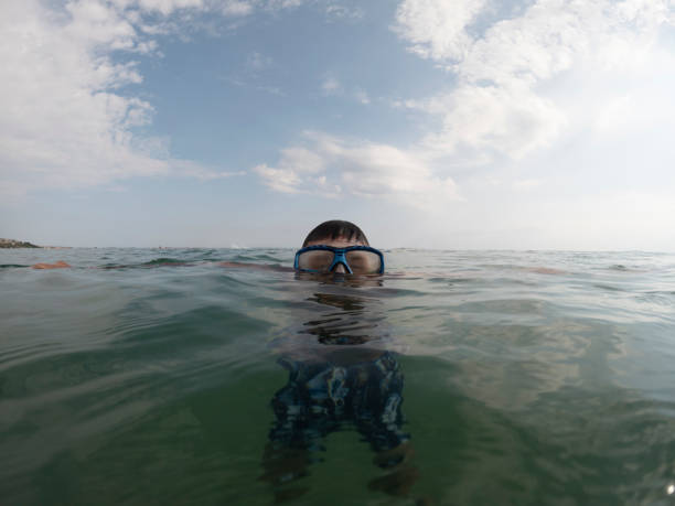 Man tourist enjoy recreational snorkeling on summer vacation