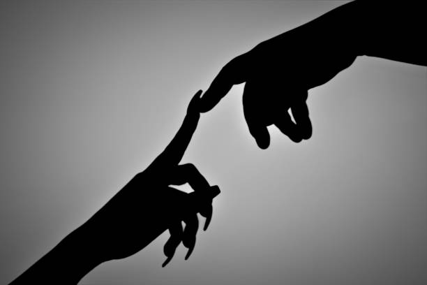 istock Touch of fingers - closeness 2196963686