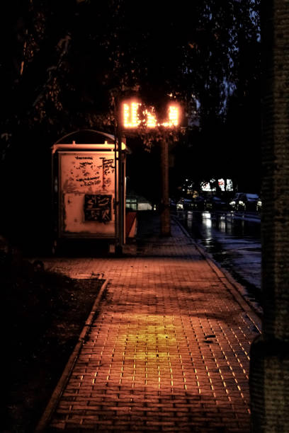 istock An empty bus stop on a gloomy, rainy day 2196963867