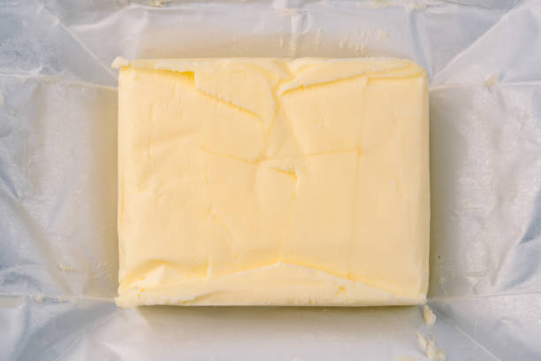 Cooking or breakfast package butter on vintage white background
