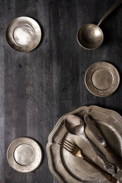 istock Vintage pewter plates, bowls and cutlery 2196964904