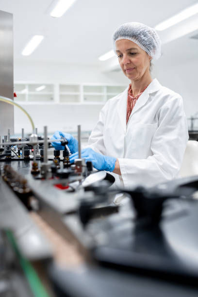 istock Pharmaceutical workers on the production line for filling and packing bottles. 2196965117
