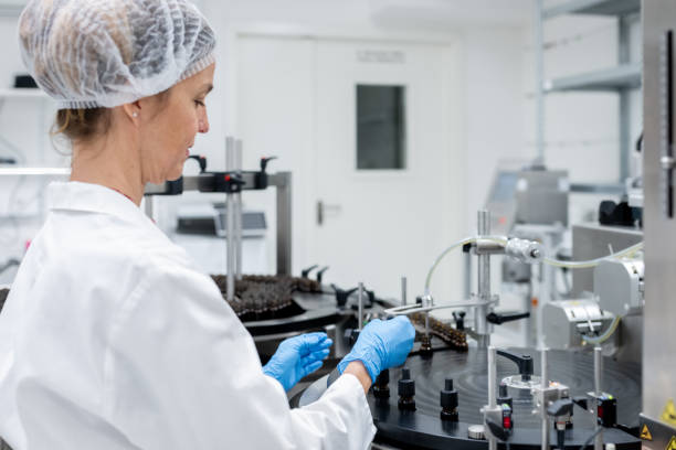istock Pharmaceutical workers on the production line for filling and packing bottles. 2196965167