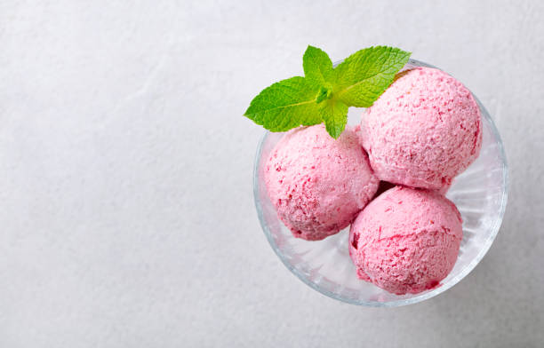 istock Strawberry Ice Cream in a glass bowl on grey background. Copy space. Top view. 2196969456