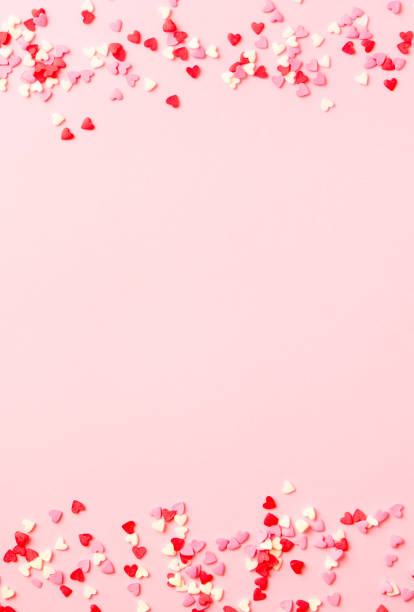 istock Sugar hearts frame on pink background. Romantic, St Valentines day concept. Top view. Copy space. 2196969534