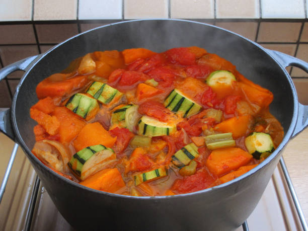 istock Pumpkin and vegetable soup cooking in a cast iron casserole dish 2196970103