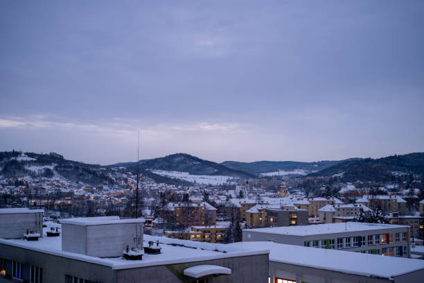 istock Winter Townscape with Twilight Glow and Snow-Covered Hills 2196970481