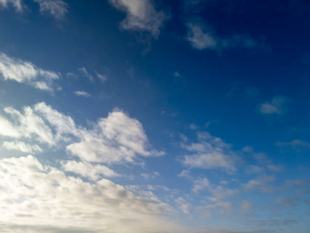 istock A beautiful sky showcasing fluffy clouds against a vibrant blue backdrop, perfect for serene and peaceful imagery. 2196973016