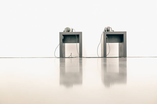istock two side tables with headphones in an empty room 2196973127