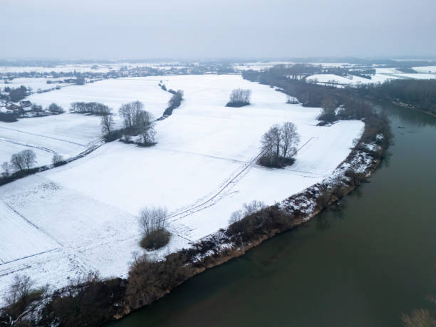 Free Stock Photo of Aerial view of icy river and snow-covered land ...