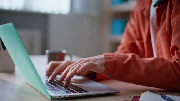 istock Typing manager talking cellphone at busy workday closeup. Smiling businessman 2196974111