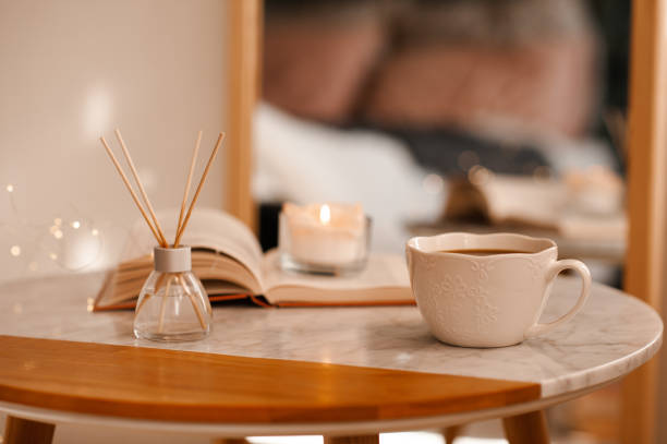 istock Cup of tea with book on table 2196975936