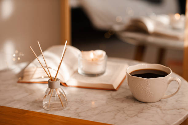 istock Cup of tea with book on table 2196975940