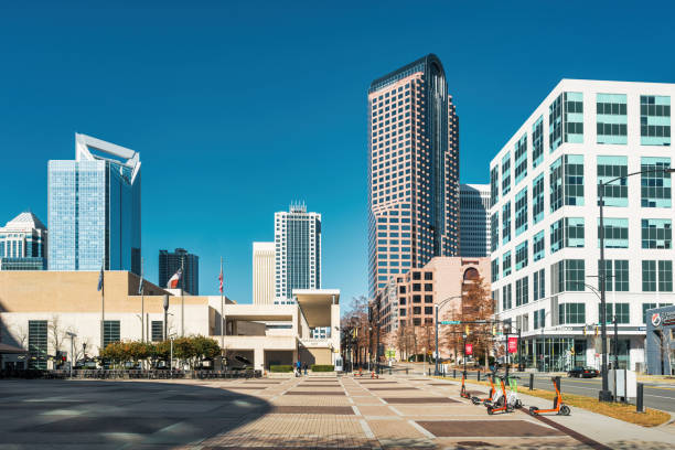 Charlotte, NC, USA. Jan 20,2020: A gathering of people protesting  at Romare Bearden Park, located in  the financial district of Uptown Charlotte,  North Carolina.