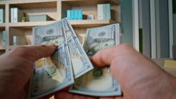 istock Businessman hands counting usa banknotes in office closeup. Unknown rich man 2196978224