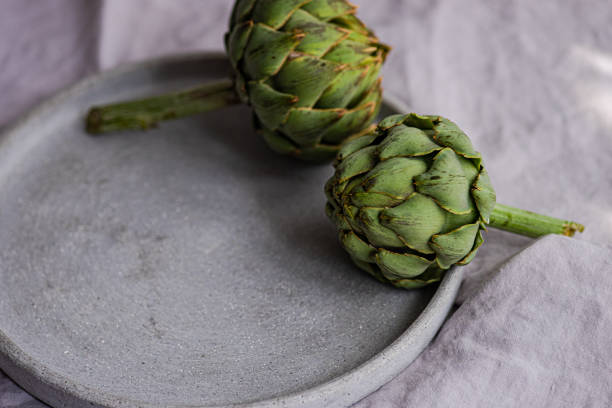 Raw green artichoke bud on the table in Tbilisi, Tbilisi, Georgia