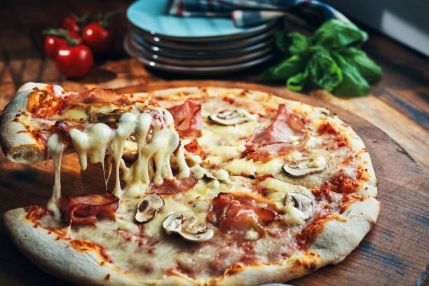 istock Pizza with Prosciutto Cotto Ham and Mushrooms 2196985360