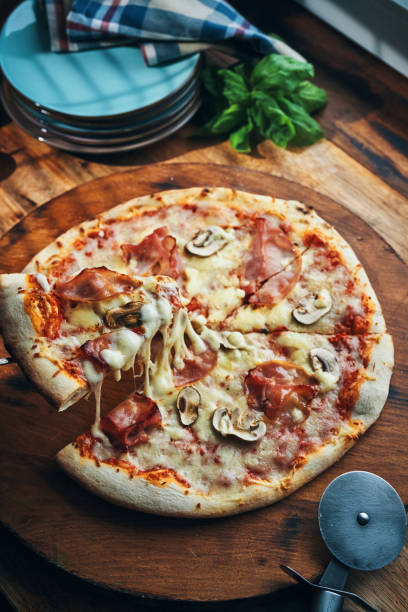 istock Pizza with Prosciutto Cotto Ham and Mushrooms 2196985377