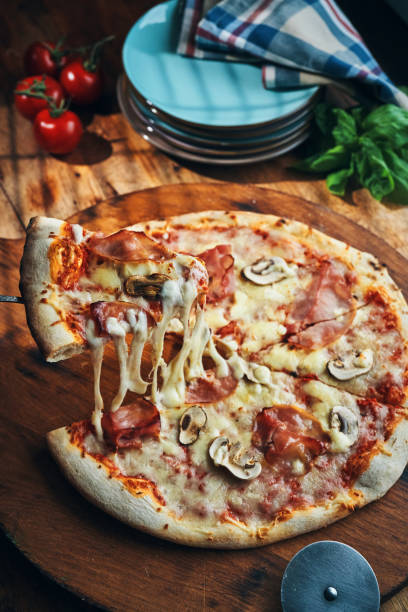 istock Pizza with Prosciutto Cotto Ham and Mushrooms 2196985392