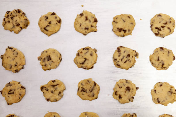 istock raw cookie dough divided into small cookies ready to bake 2196985475