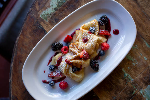 istock looking down on dessert crepe with fruit 2196985505