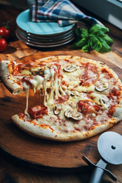 istock Pizza with Prosciutto Cotto Ham and Mushrooms 2196985530