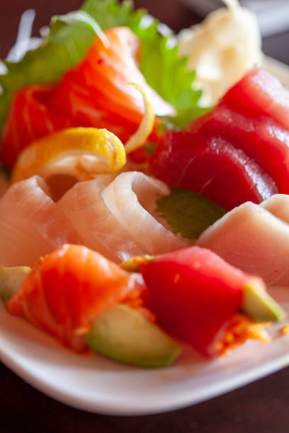 istock Close up on sashimi raw fish salad vertical 2196985603