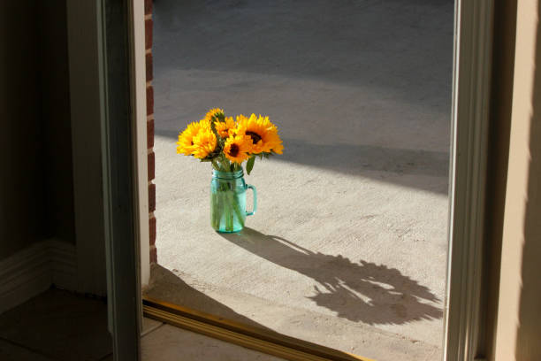 Sunset Yellow Sunflower Bouquet Shadow Through a Door in Houston, Texas, United States