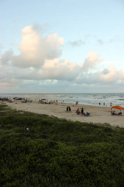 istock People Playing on the beach at sunset 2196985926