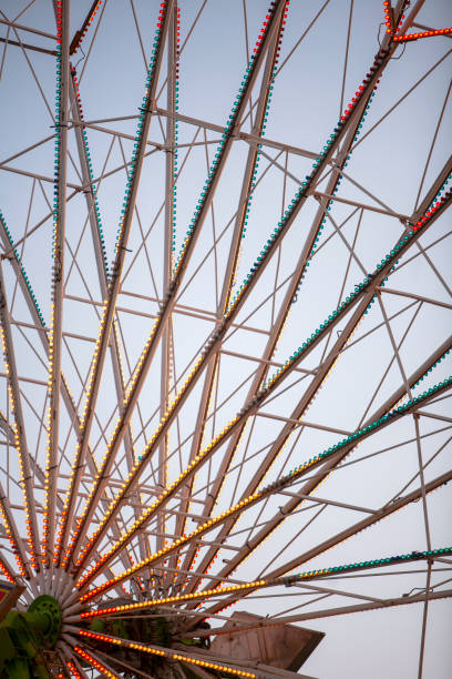 istock Ferris wheel detail spokes supports at dusk vertical 2196986049