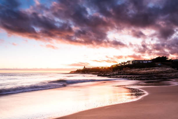 istock Serene sunset on the beach with waves and dramatic clouds 2196986252