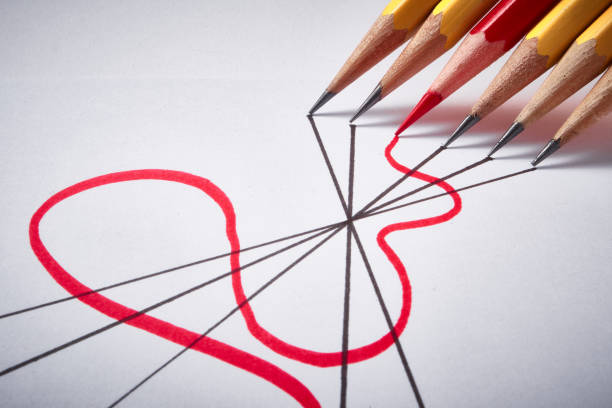 Wooden pencils, the individual emerging from the crowd in Golden, Colorado, United States