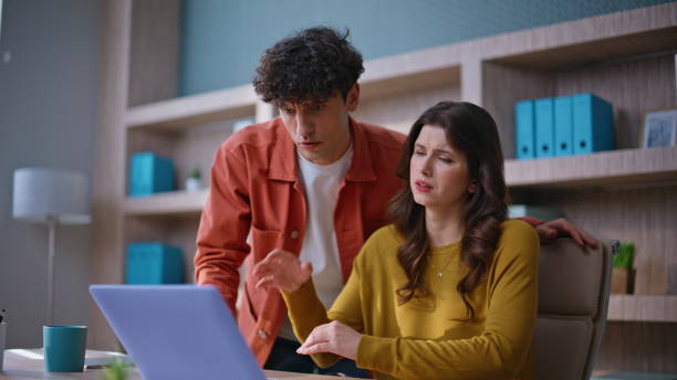 istock Frustrated colleagues reacting failure at office closeup. Concerned coworkers 2196989680