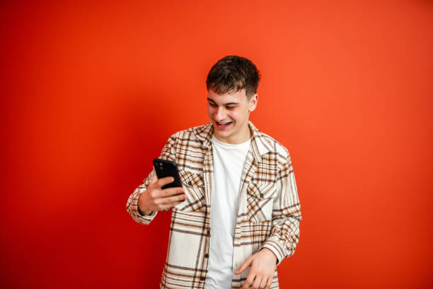 istock young man make have a video call on mobile phone talk studio shot 2196991575
