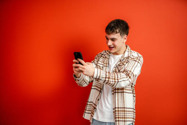 istock young man make have a video call on mobile phone talk studio shot 2196991582